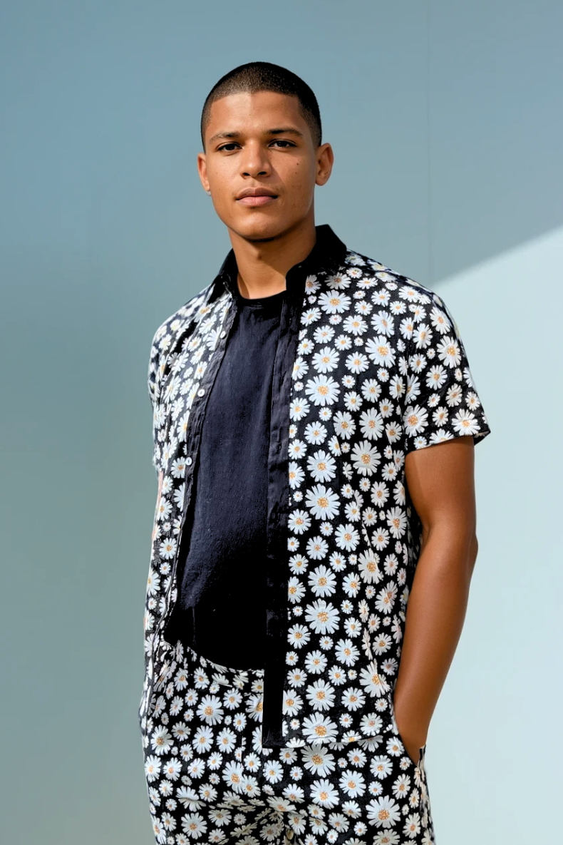 Model wearing the Sea Dragon Studio Daisy Cutter summer set in cotton with daisy print, styled for warm weather days.