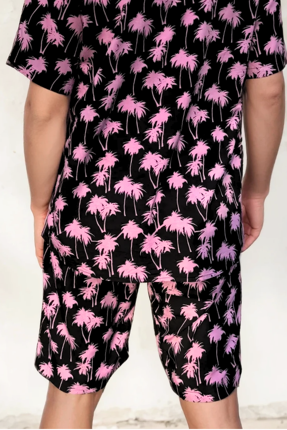 Back view of the Malibu Barbie Palm Party shorts showing the pink palm print on lightweight black rayon.