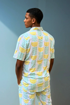 Back view of the Green & Gold Summer Sessions Shirt highlighting the all-over green and gold print and easy summer drape.