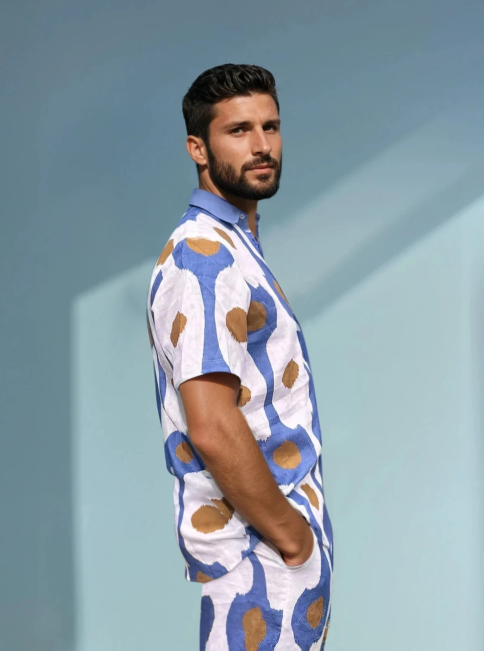 Side view of the Into the Sun men’s linen shirt and shorts set in blue dot print.