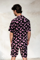 Back view of the Malibu Barbie Palm Party shirt showing the full pink palm print on lightweight black rayon.