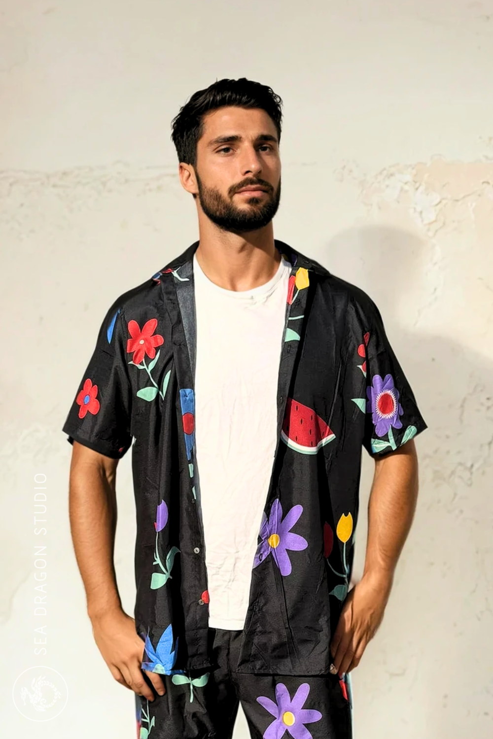 Model wearing the Midnight Picnic shirt and shorts set facing forward against a neutral wall.