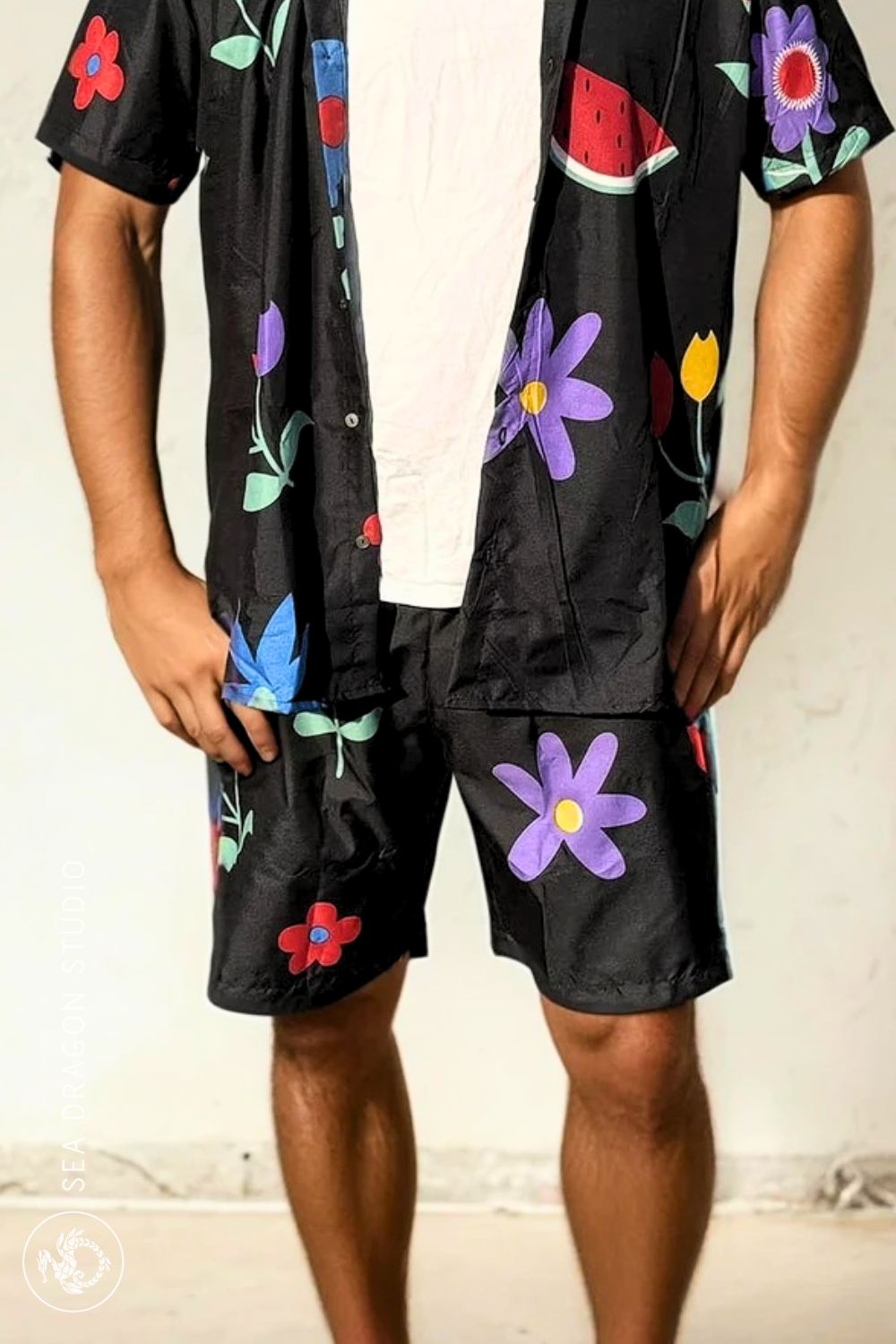 Model wearing the Midnight Picnic shirt and shorts set looking forward against a neutral wall.