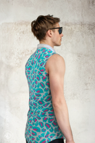 Back view of the Sea Dragon Studio Tecno Tiger sleeveless shirt in teal and magenta animal print, styled for festivals, parties and summer wear.