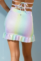 Back view of pastel rainbow holographic mini skirt with ruffled hem, Unicorn Dreams fabric.
